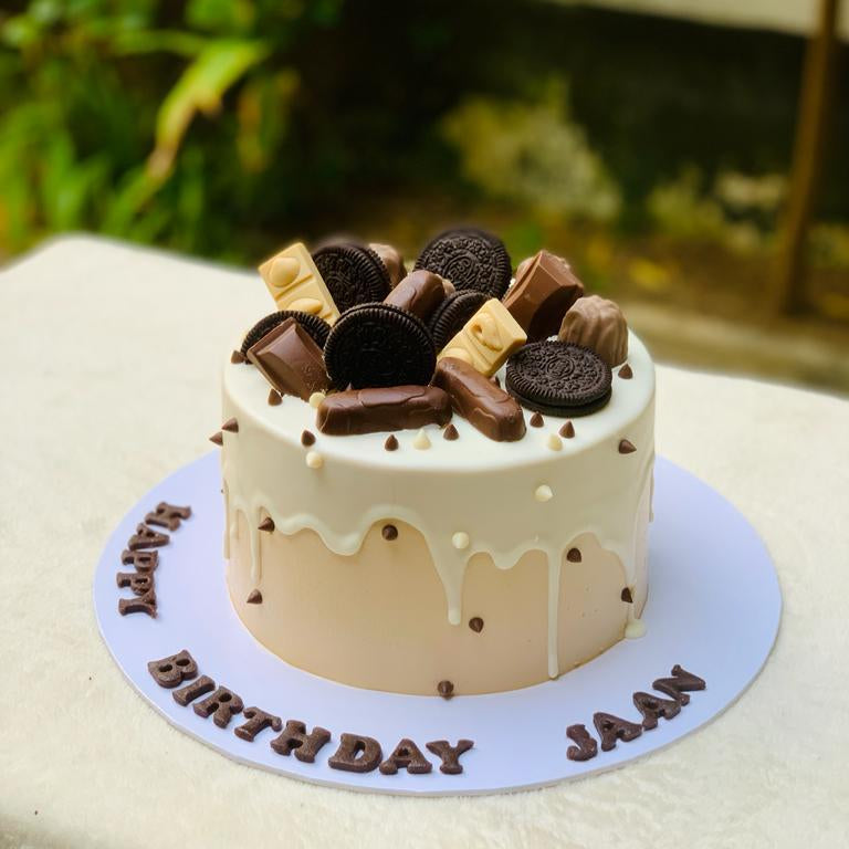 Birthday cake with chocolate decorations.