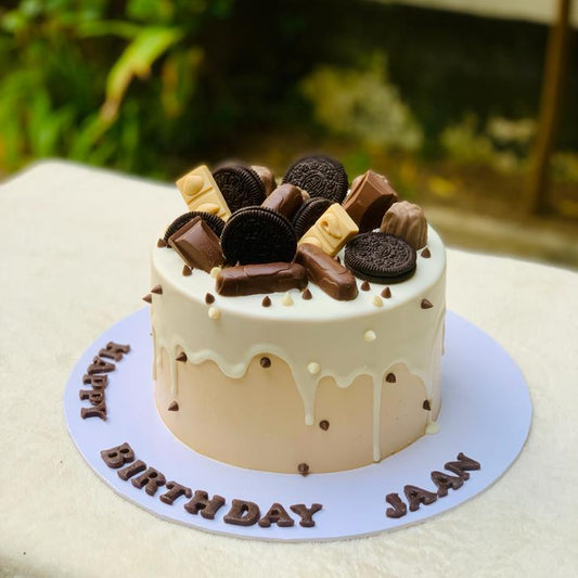 Birthday cake with chocolate decorations.